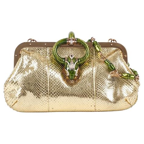 gucci emerald snake clasped purse|Gucci mini clutch.